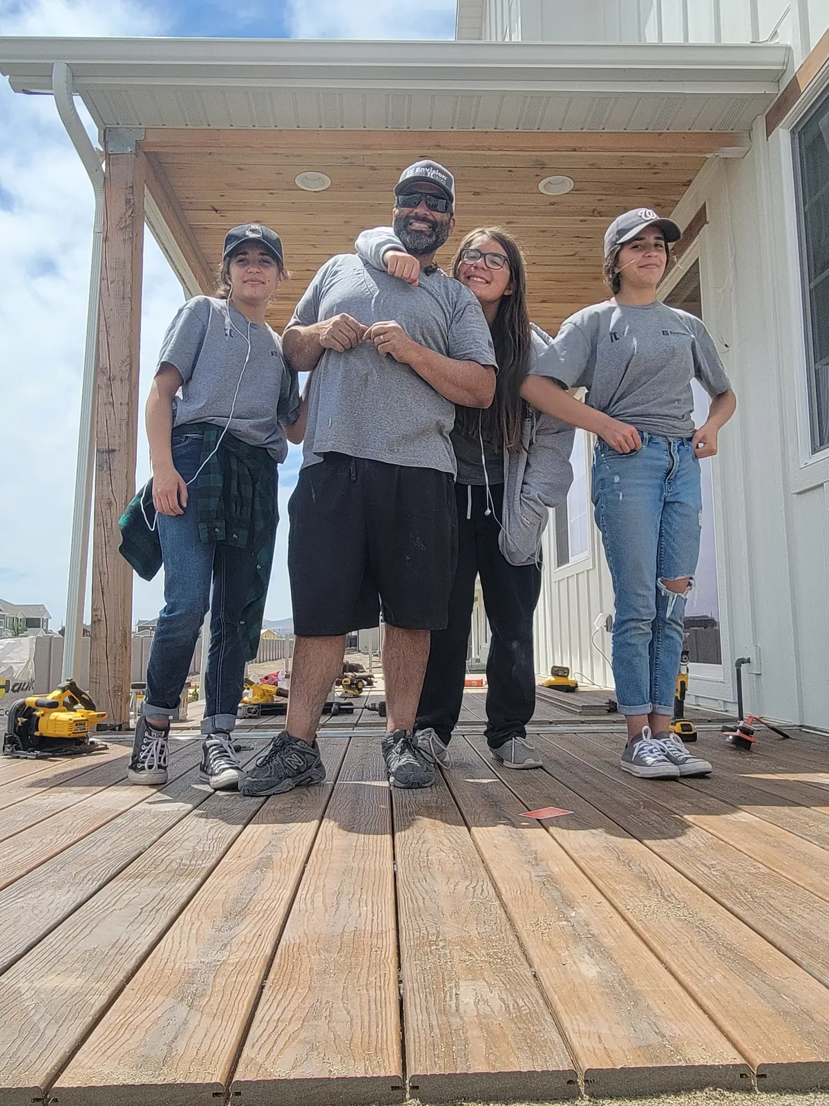 Levi Tippetts with his daughters on the deck they built for The House that She Built