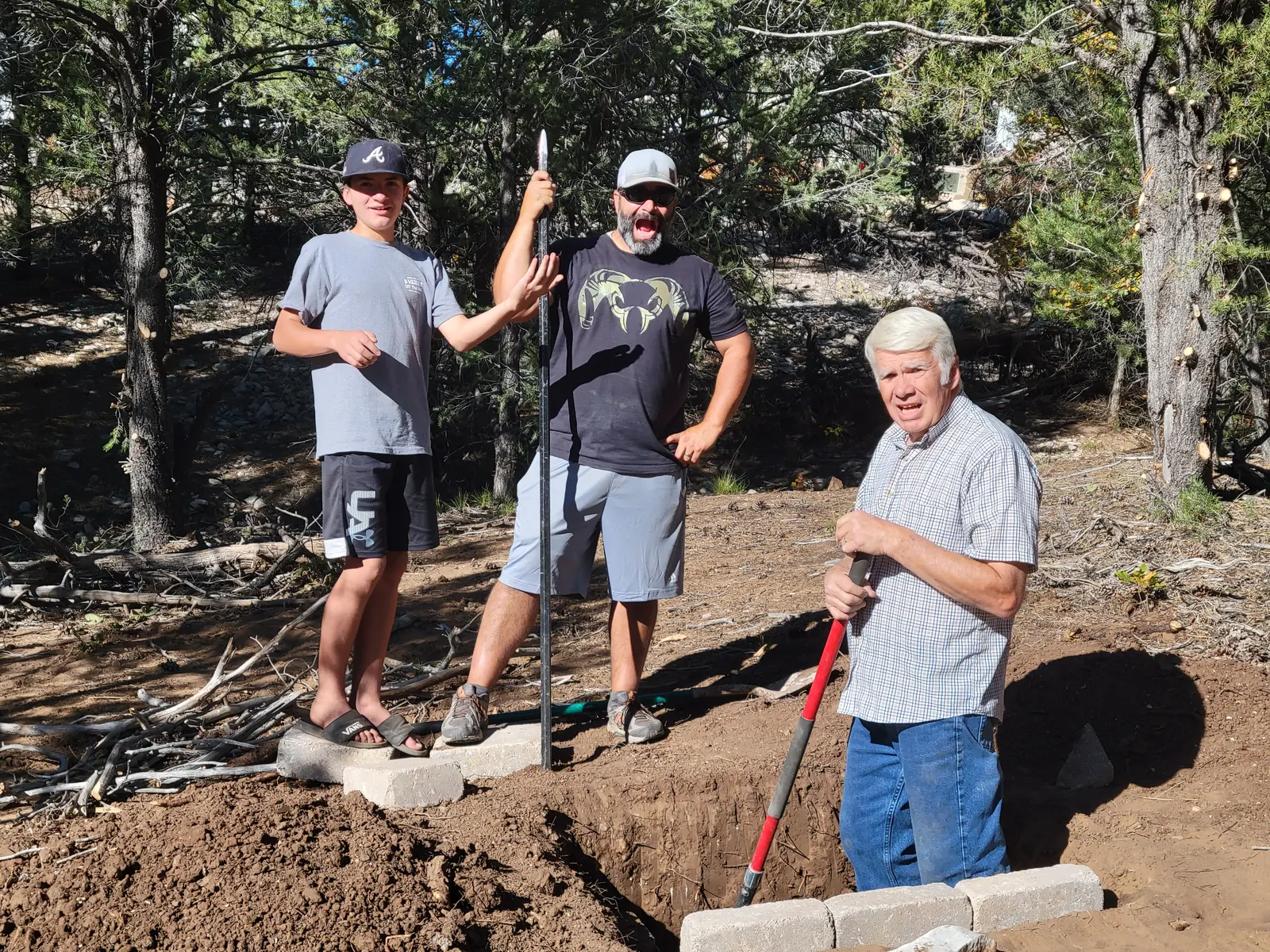 Phinn, Levi and Kevin Tippetts, three generations of builders, on a job site