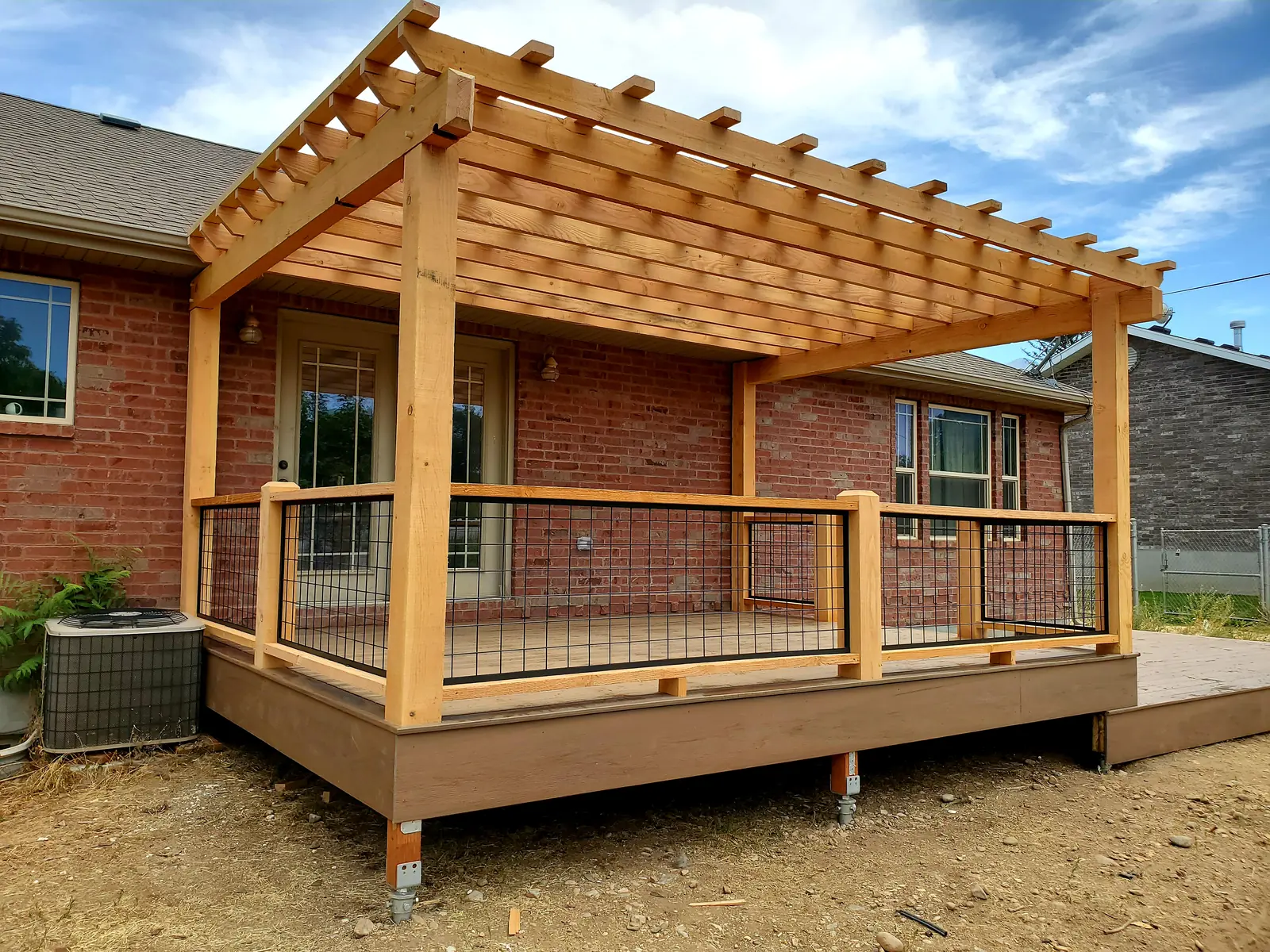 Cedar pergola over a new composite deck