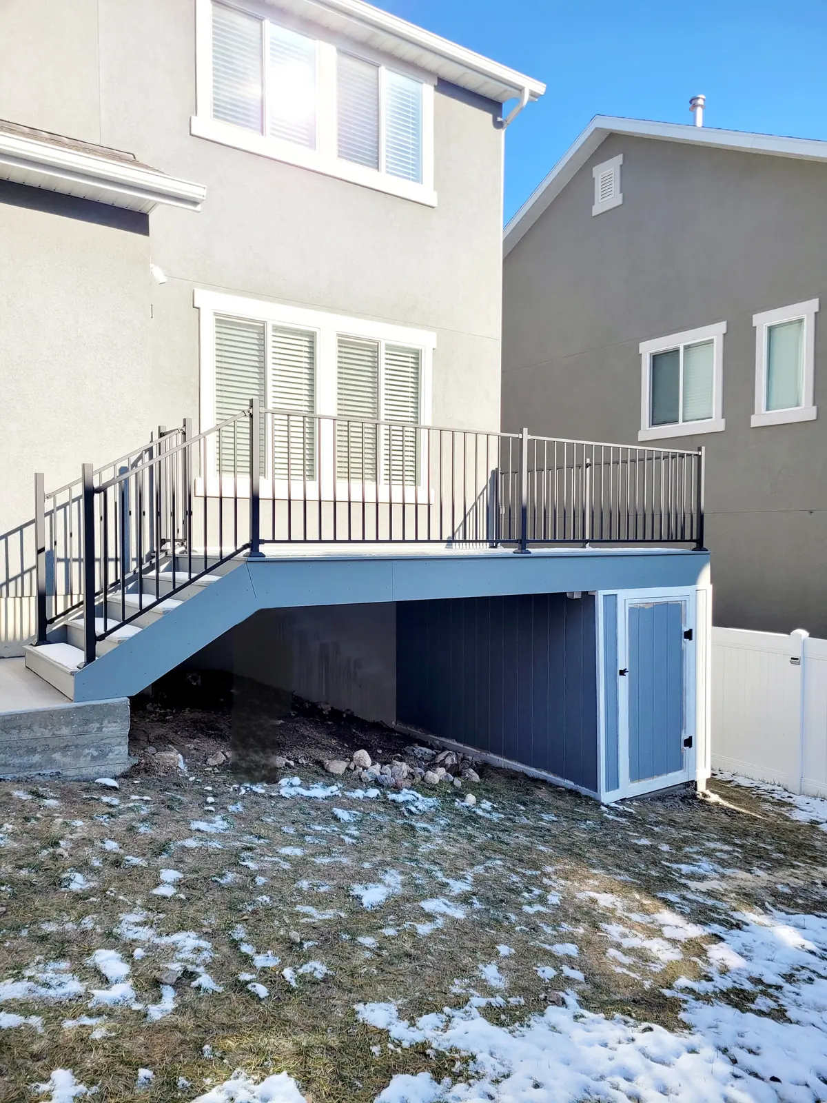 Enclosed storage under a raised deck