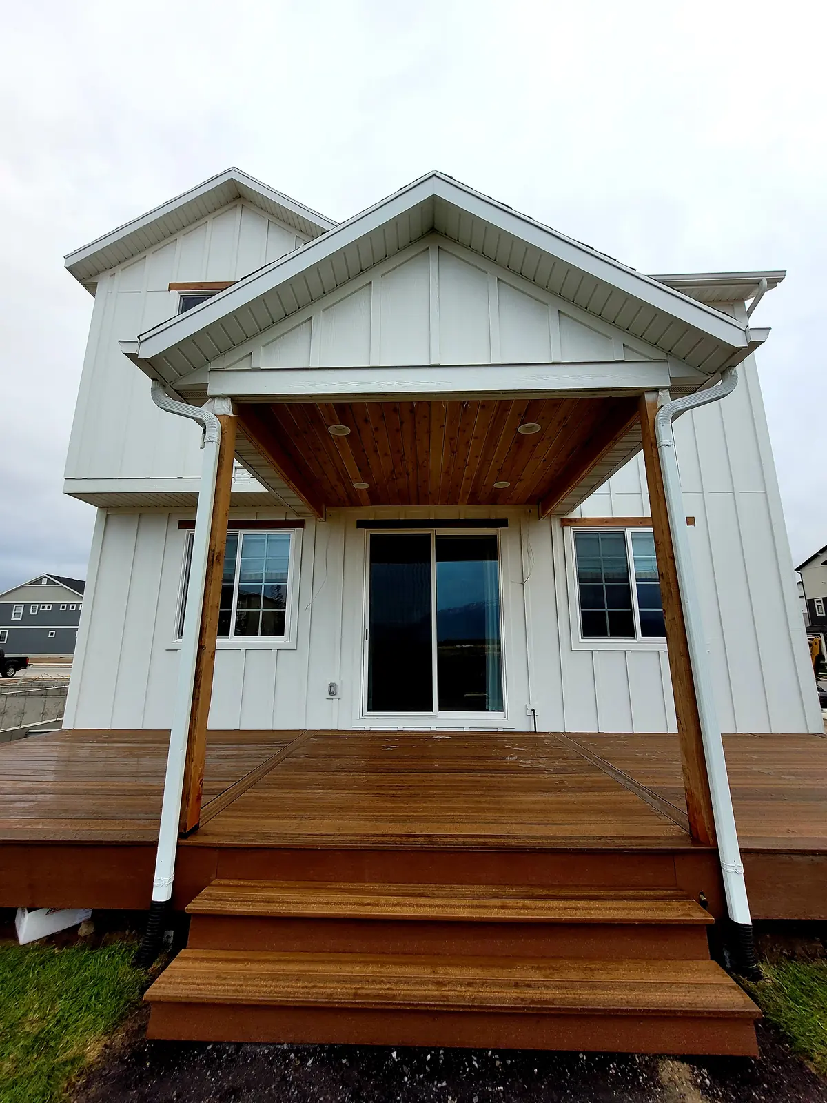 Finished covered back deck with wide steps on a Parade of Homes house in Saratoga Springs