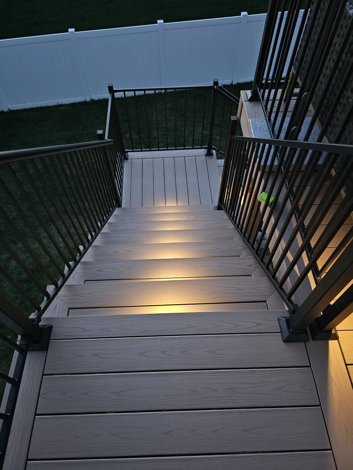 Lit deck stairs seen from the top