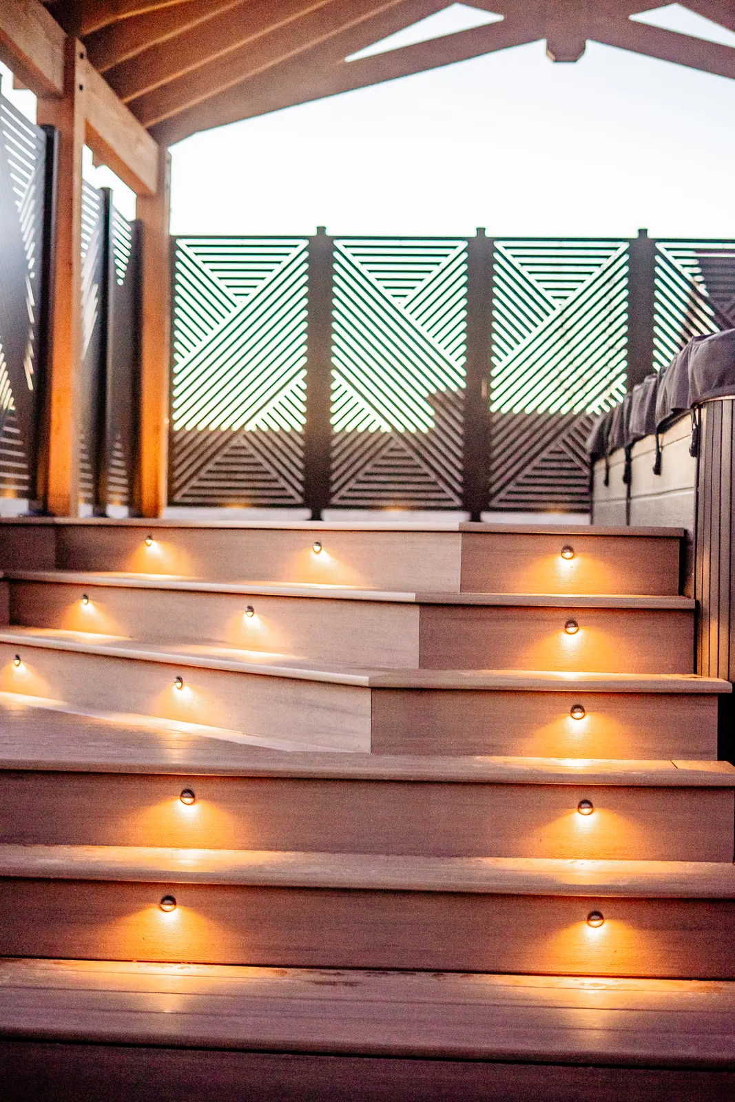Lit English Walnut stairs leading up to a HideAway privacy screen