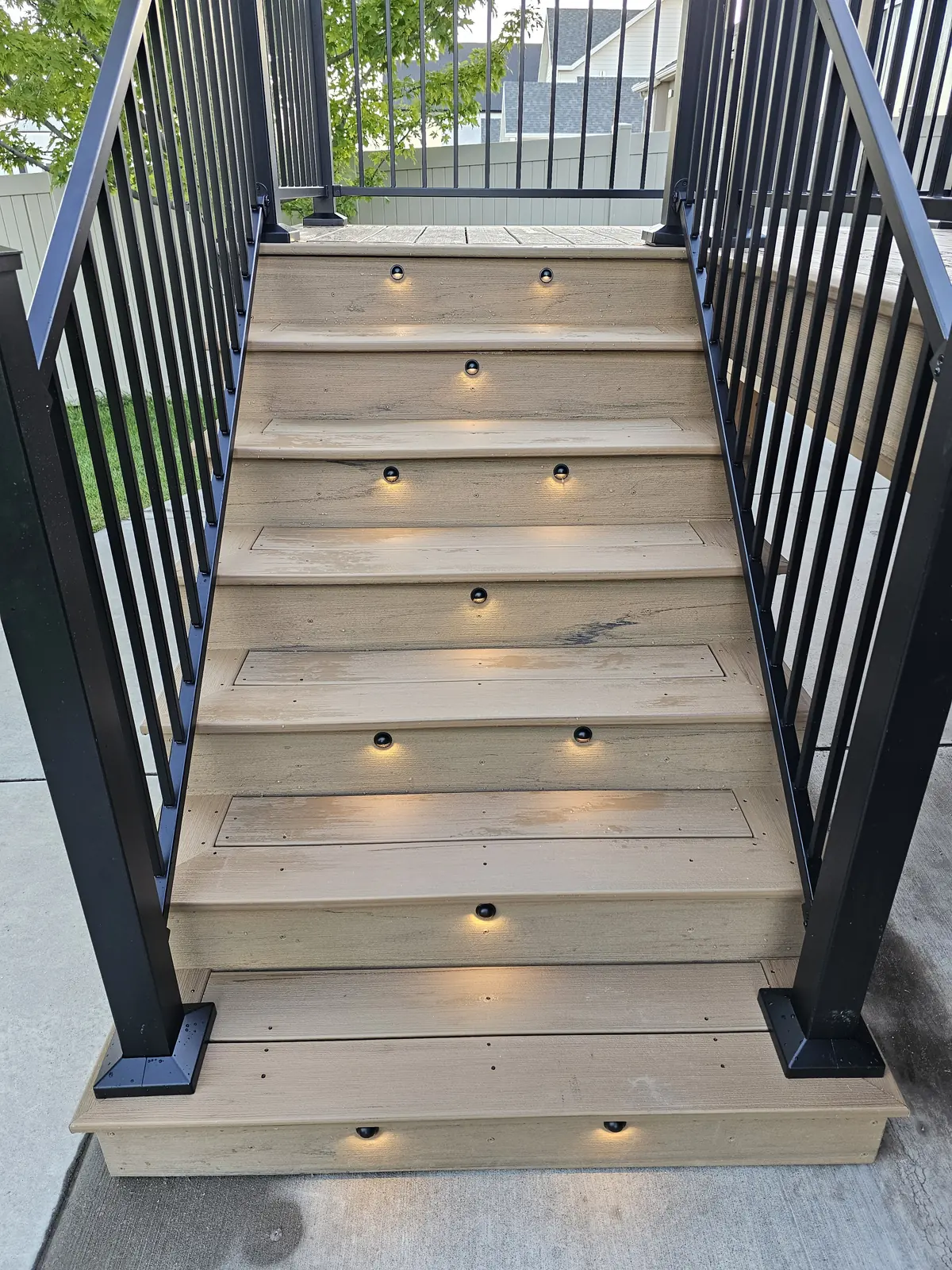Composite deck stairs with riser lights
