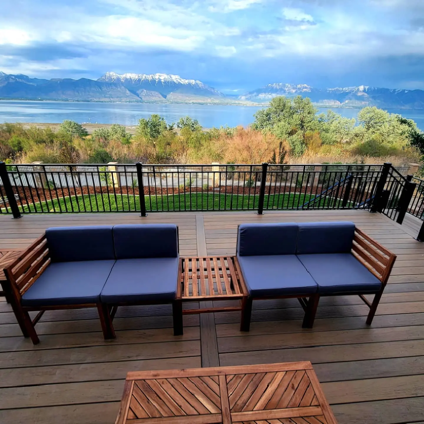 Outdoor seating on a TimberTech Tiger Wood deck overlooking Utah Lake
