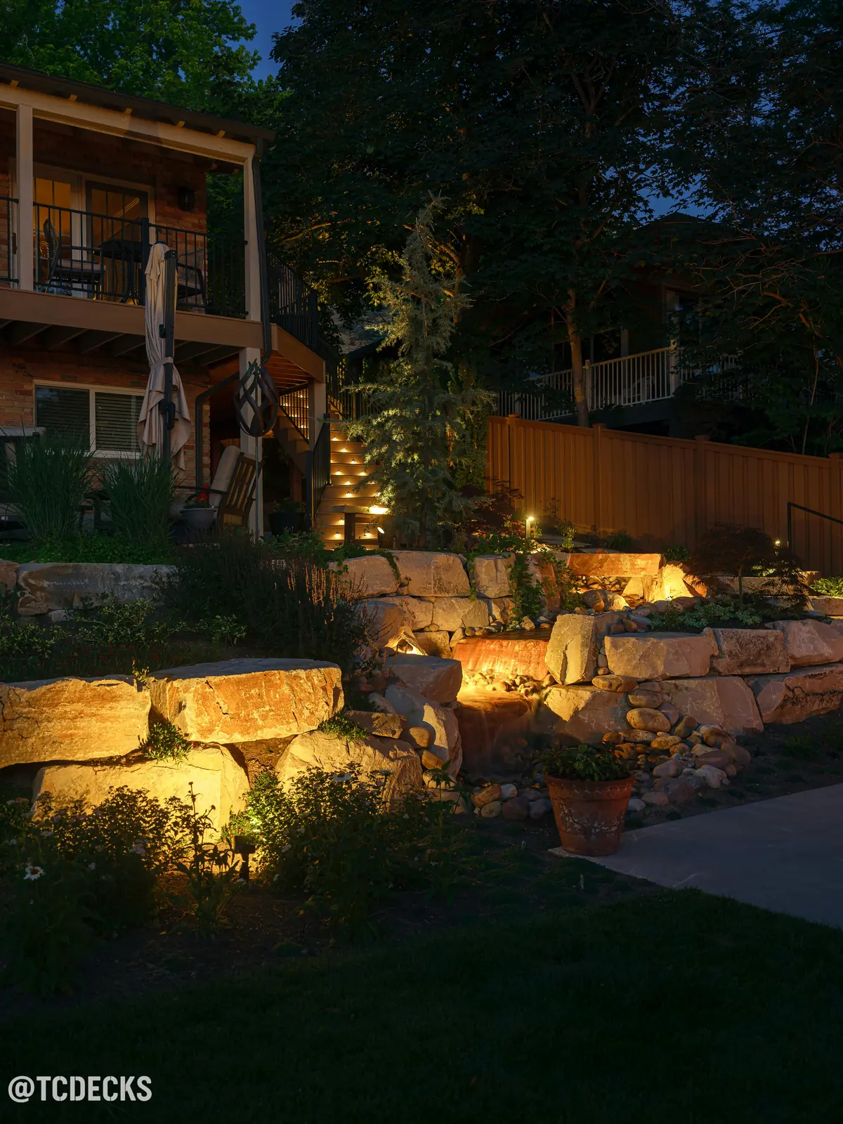 Deck and lit stairs at night