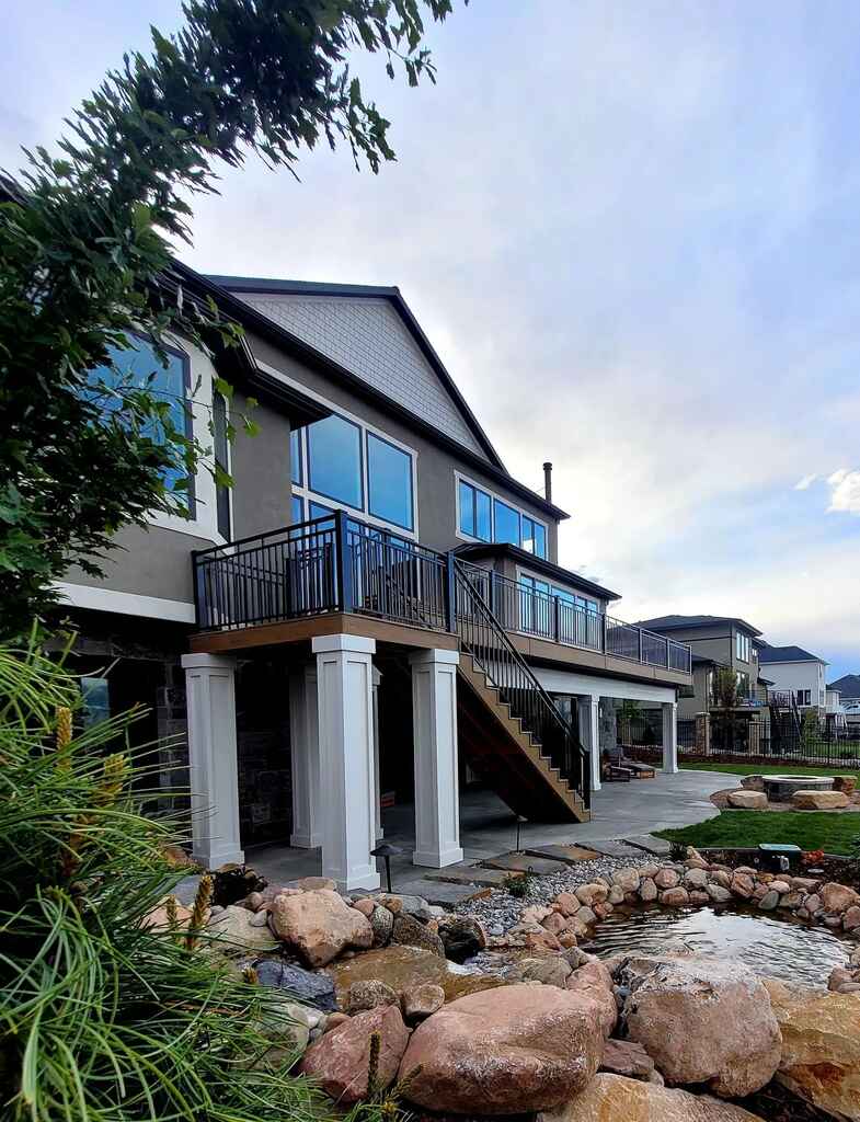 Durability and style in homes are added by stone walls and benches by TC Decks.