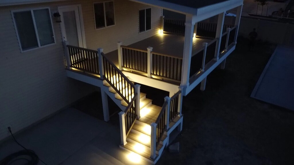Illuminated designs by TC Decks feature clock-topped buildings.
