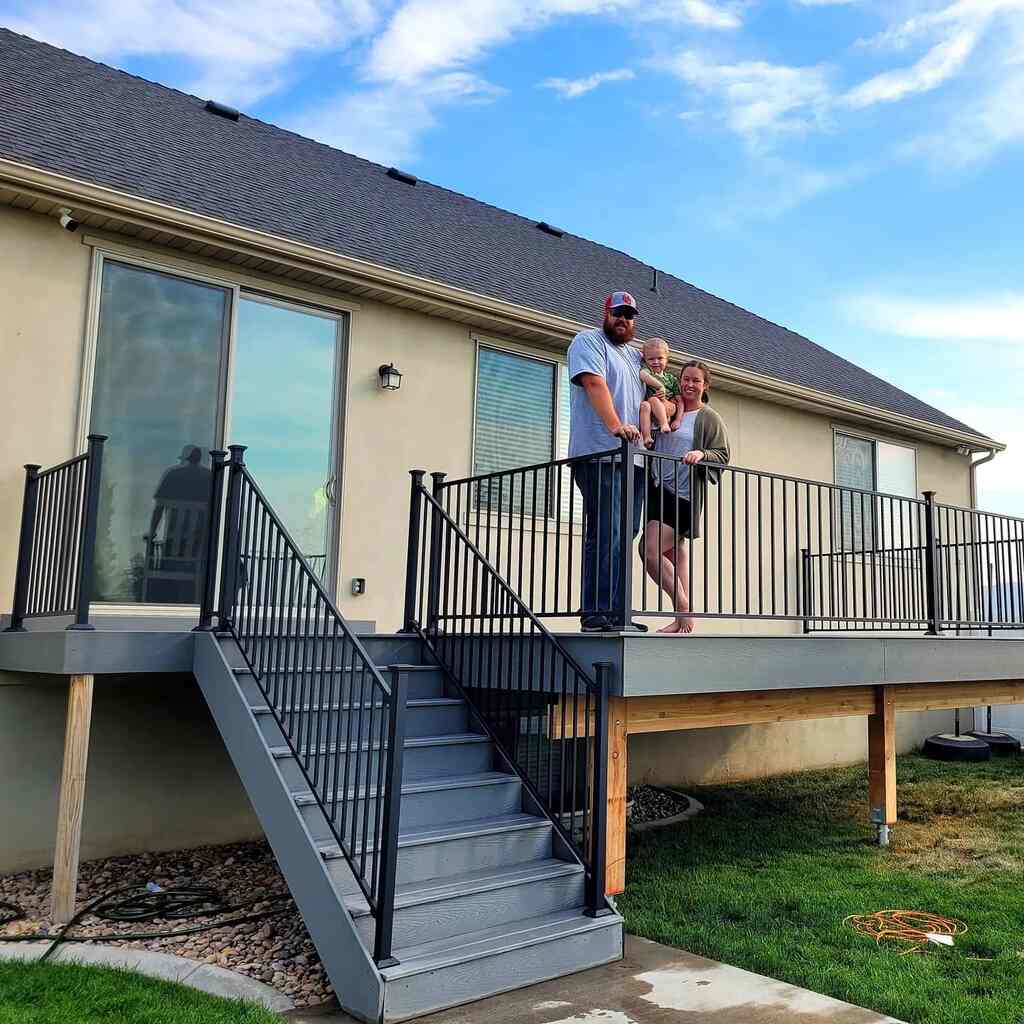 Couples enjoy city views from balconies crafted by TC Decks.