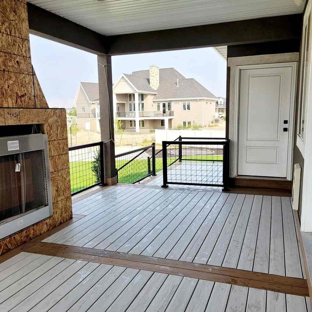 Functional elegance in kitchens blends walkways with fireplaces by TC Decks.