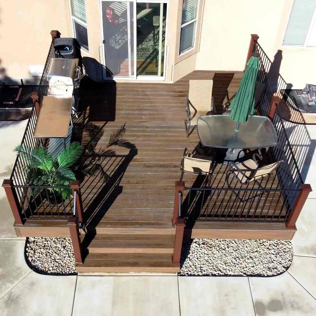 Patios are made inviting with wooden benches and fences by TC Decks.