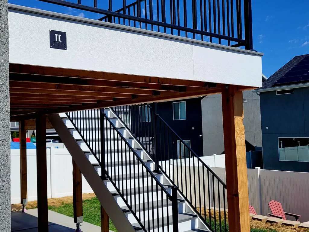 Captivating views are enjoyed from stairways to buildings with blue railings by TC Decks.