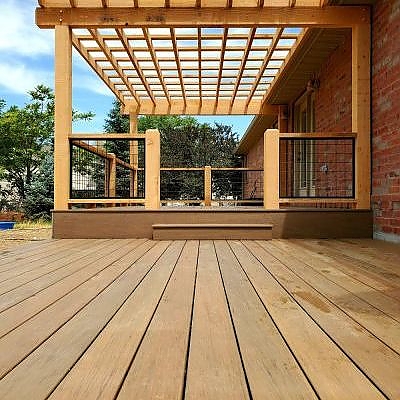 Discover seamless outdoor charm with TC Decks' wooden decks and doors.